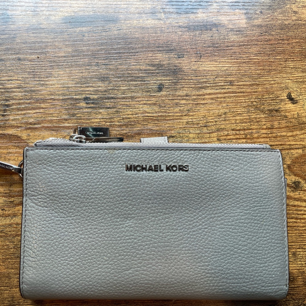 Michael Kors Wrist wallet | used it quite a bit but it’s still in good shape